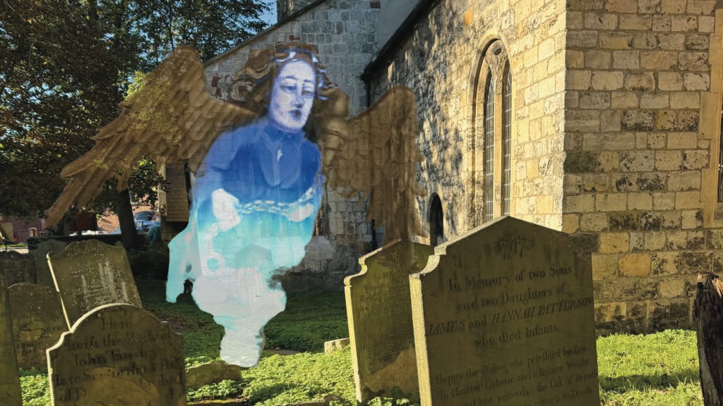 A medieval angel figure floats over a gravestone in a sunny graveyard.