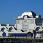 Southsea's Clarence pier with its silver cupolas and a bright blue sky.