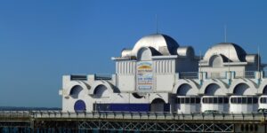 Southsea's Clarence pier with its silver cupolas and a bright blue sky.