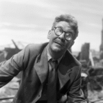 Burgess Meredith from the Twilight Zone episode Time Enough at Last. He is alone at last now everybody else in the world is gone. He can learn and read as much as he likes. Until he breaks his glasses that is.
